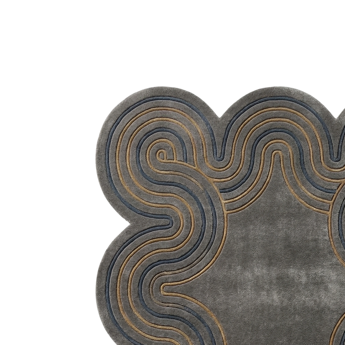 A close-up of a gray textured rug with a scalloped edge and layered wavy patterns in dark blue and tan.