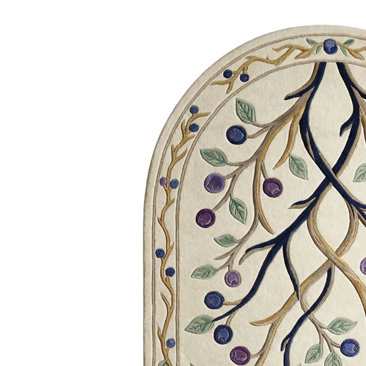 Close-up of an arched rug or textile with a cream base, dark navy and tan branches, green leaves, and purple-blue berries on a white background.