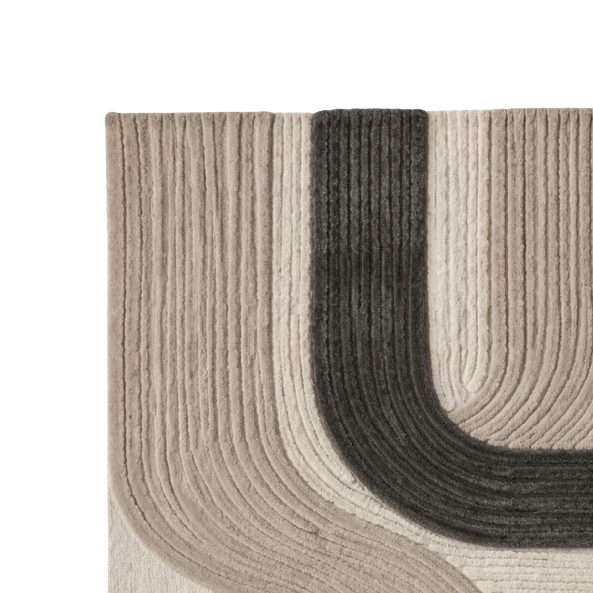 Close-up of a ribbed area rug showing a curved corner design in beige, cream, and dark charcoal gray.