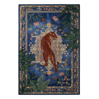 Blue tiger botanical hand-tufted wool area rug with ornate border and jungle foliage design