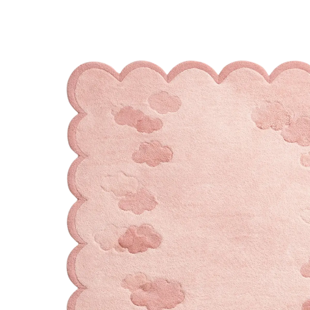 A close-up of a light pink textured rug with a scalloped edge and subtle cloud-like raised patterns, shown on a white background.