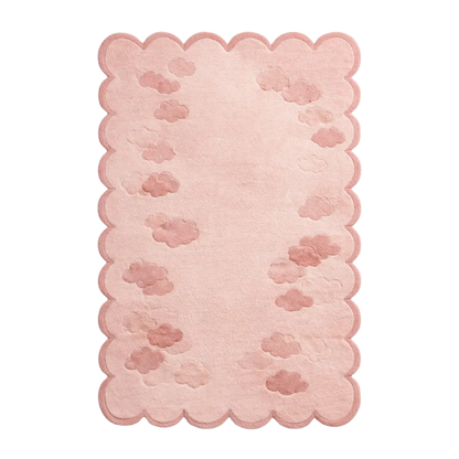A rectangular pink rug with a scalloped border and embossed cloud patterns, shown flat against a white background.