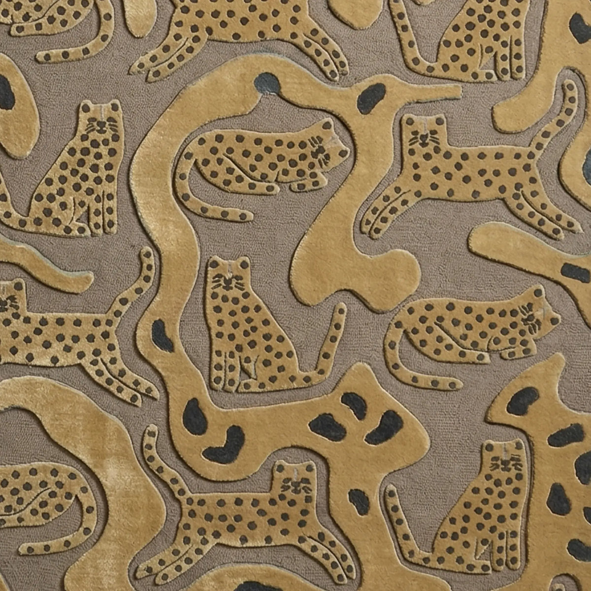 A close-up of a textured area rug featuring a pattern of stylized cheetahs and leopards in tan and dark brown on a taupe background.