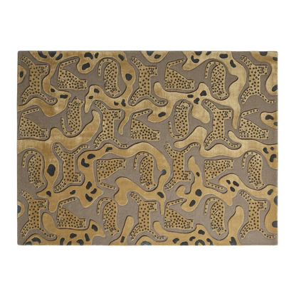 A rectangular area rug with an abstract organic pattern in shades of gold, brown, and black, shown flat against a white background.