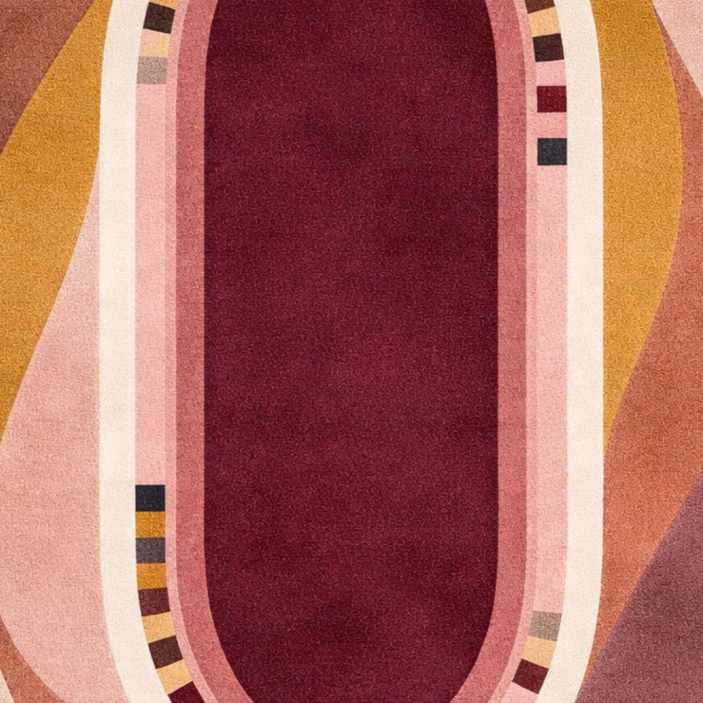 A close-up of a patterned textile or rug featuring a central deep burgundy oval bordered by pink, cream, mustard yellow, and mauve wavy stripes with small geometric accents.