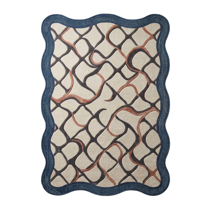 A rectangular area rug with a scalloped wavy border, featuring an abstract interlocking geometric pattern in dark charcoal and warm terracotta on a cream background.