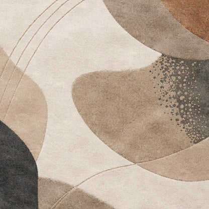 Abstract area rug with organic flowing shapes in beige, taupe, cream, brown, and charcoal gray, featuring a textured pile and fine stitched detailing.