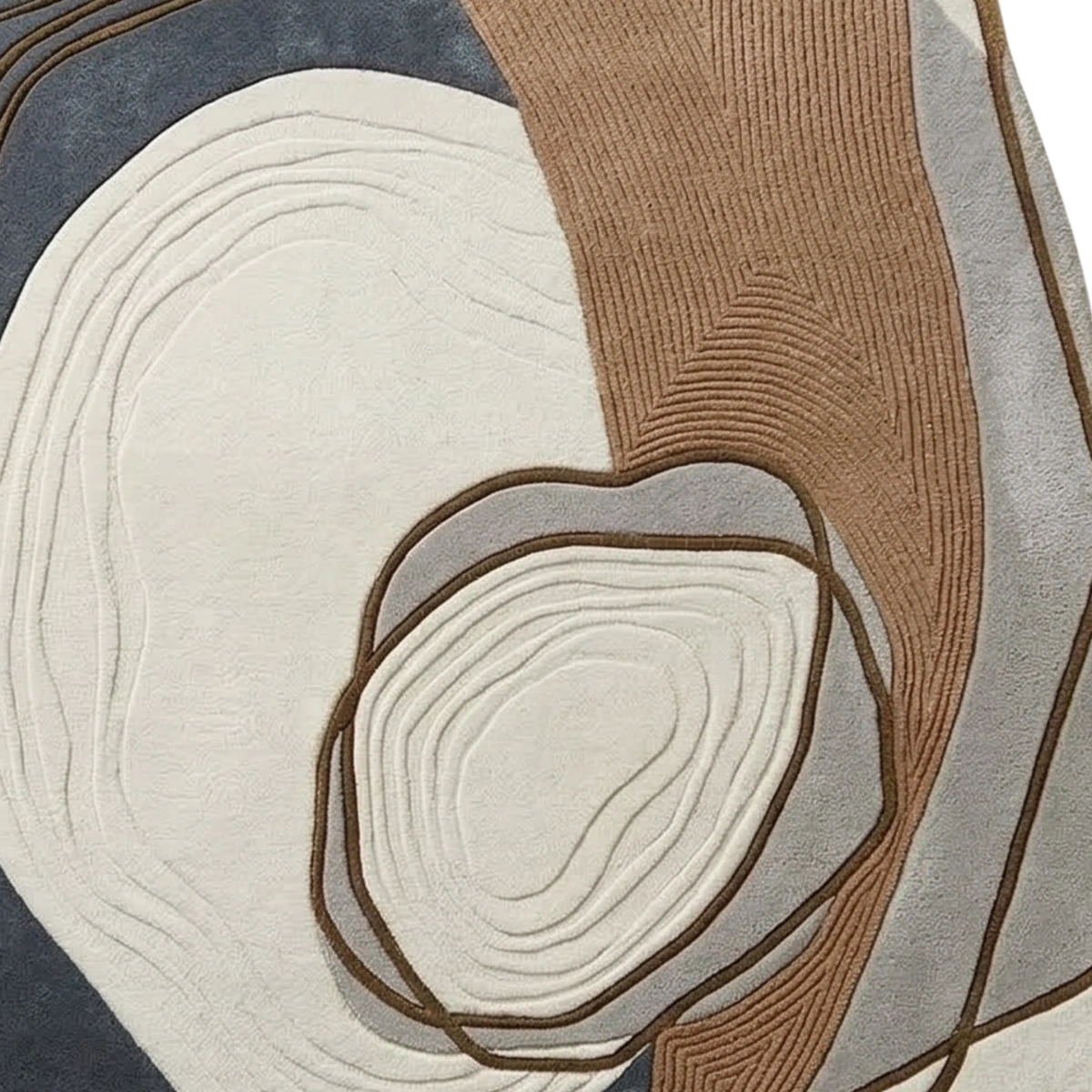 Abstract area rug with organic layered shapes in cream, taupe, gray, and slate blue, featuring raised concentric line textures.