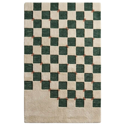 A rectangular area rug with a geometric checkerboard pattern, featuring dark green and cream squares with small rust-brown accents at the intersections, shown flat against a white background.