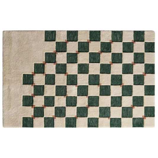A rectangular area rug with a textured geometric pattern featuring dark green squares on a warm beige background, with small brown accents at the intersections.