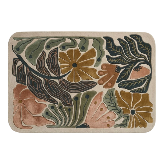 Modern floral wool rug with sculpted green leaves, mustard flowers, and terracotta accents