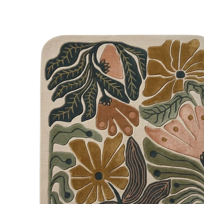 Earth-tone wool area rug with carved leaf patterns and modern floral design