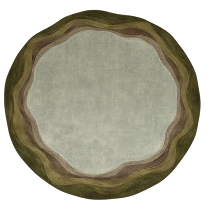 A round area rug with a scalloped organic border and a solid center, shown from a top-down view on a white background.