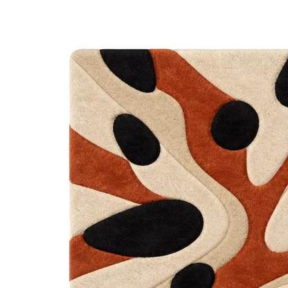 Close-up of a textured rug with an abstract organic pattern in beige, rust orange, and black on a white background.