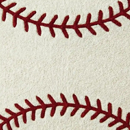 Close-up of red baseball stitches on a beige background