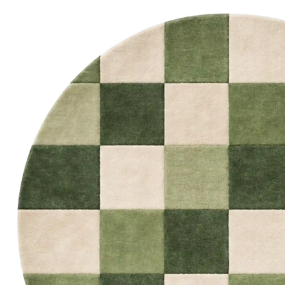 Round checkered rug with green and beige squares on a white background
