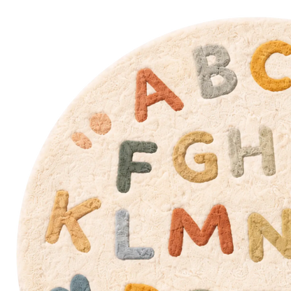 Round rug with colorful letters on a white background