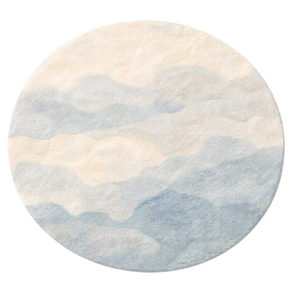 Round rug with a gradient design transitioning from beige to blue on a white background