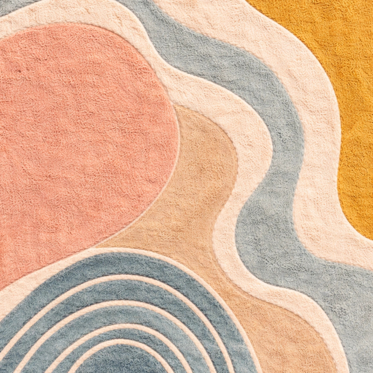 Close-up of a textured rug with abstract circular patterns in soft colors.