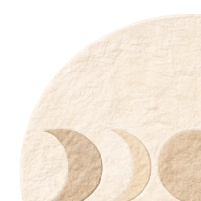 Three circular phases of the moon on a beige background
