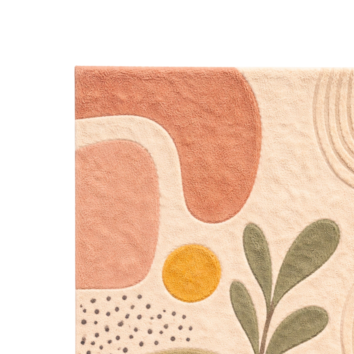 Close-up of a textured fabric with abstract patterns including shapes and leaves.