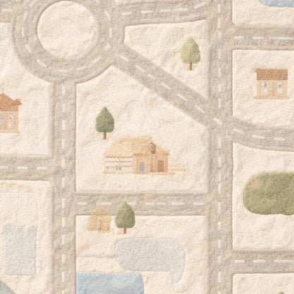Children's play mat with road, houses, and trees pattern