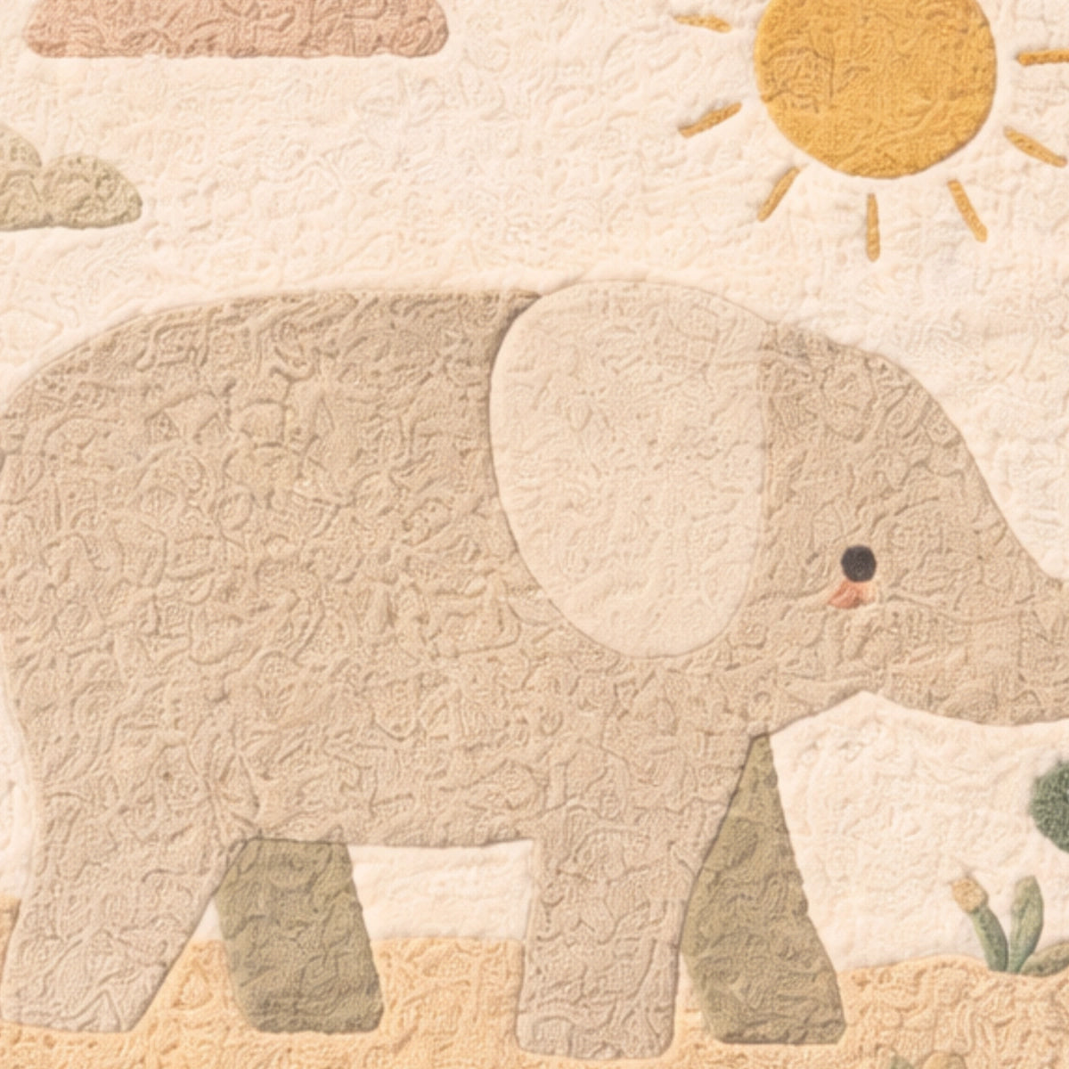 Quilted elephant design with a sun and cloud pattern on a beige background