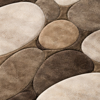 Close-up of stone-patterned tiles in brown and beige tones.