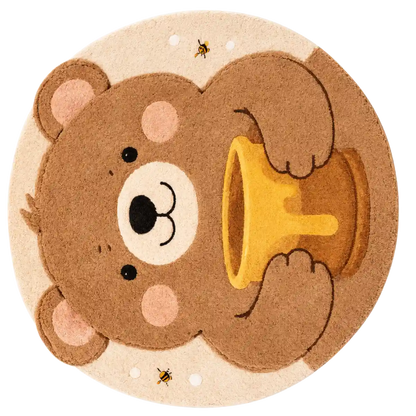 Round mat with a cartoon bear holding a bell on a beige background